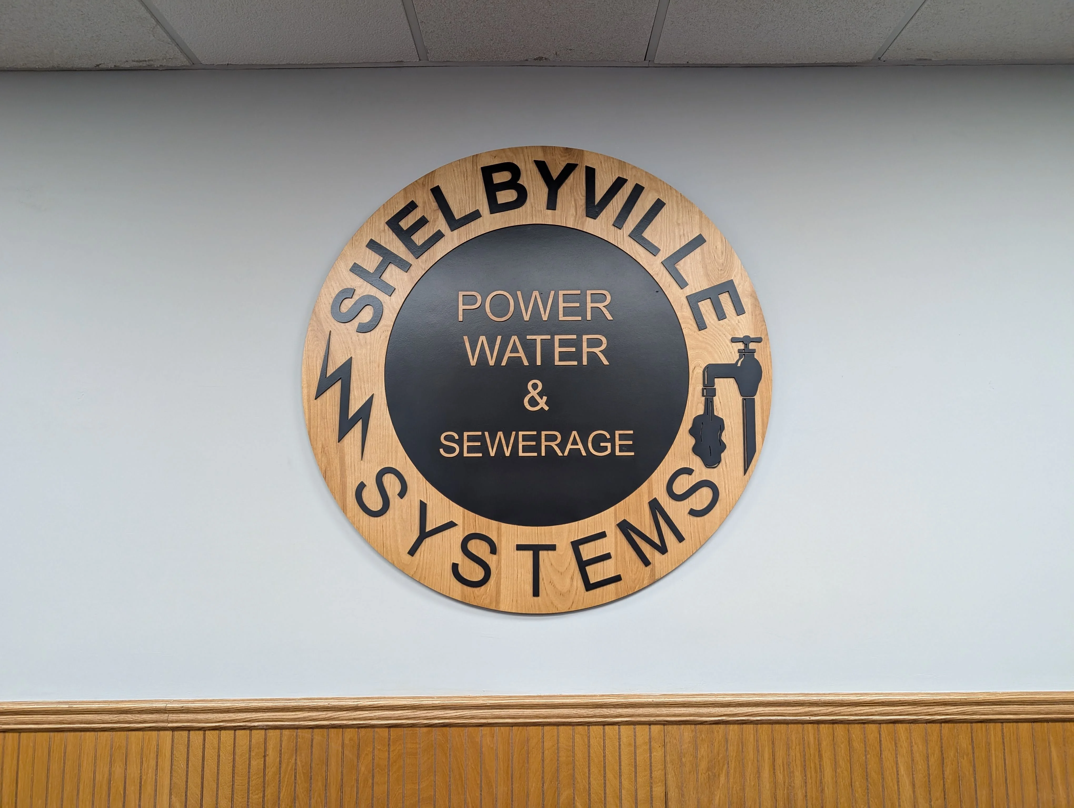 Photo of the Shelbyville Power & Water System wooden logo.